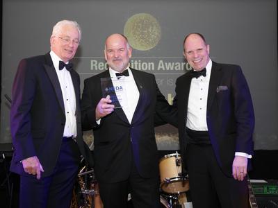 Richard Roberts, Managing Director of Trident Honda, collects his NFDA Recognition Award