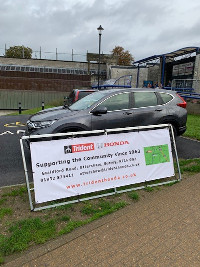 Trident Honda banner with Honda CR-V outside Woking Pool in the Park