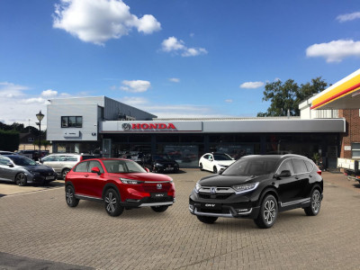 A Honda HR-V and CR-V displayed in front of our showroom